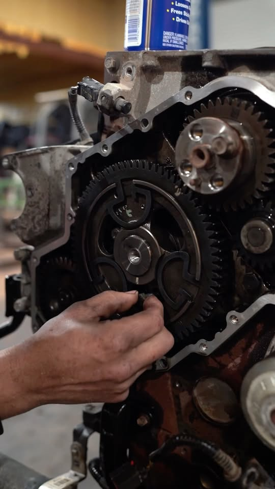 Front timing gear train being assembled on a Cummins engine